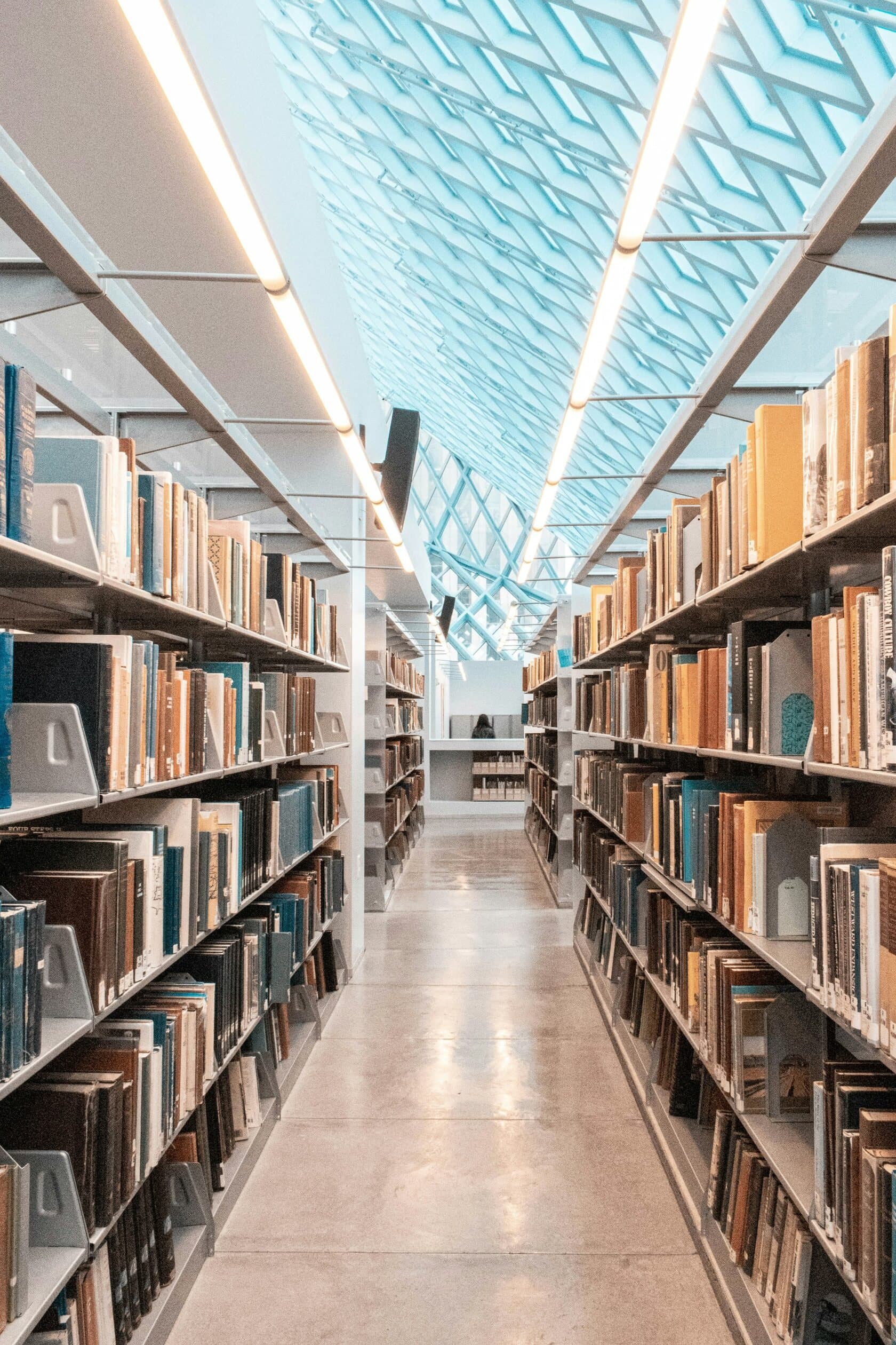 Long aisle of bookshelves in a library archive