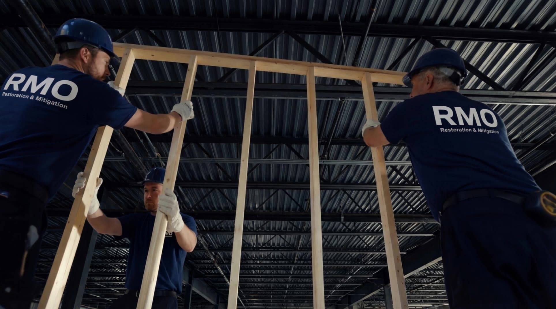 RMO crew raising new wall framing in a commercial space