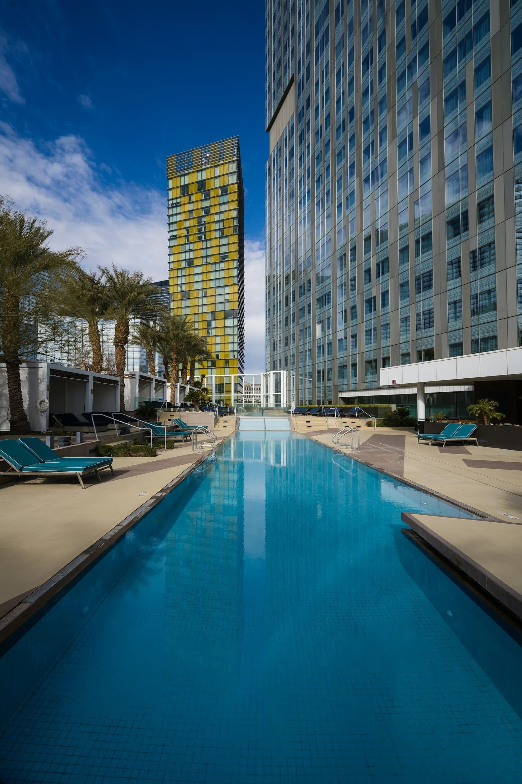 Hotel tower and pool at dusk