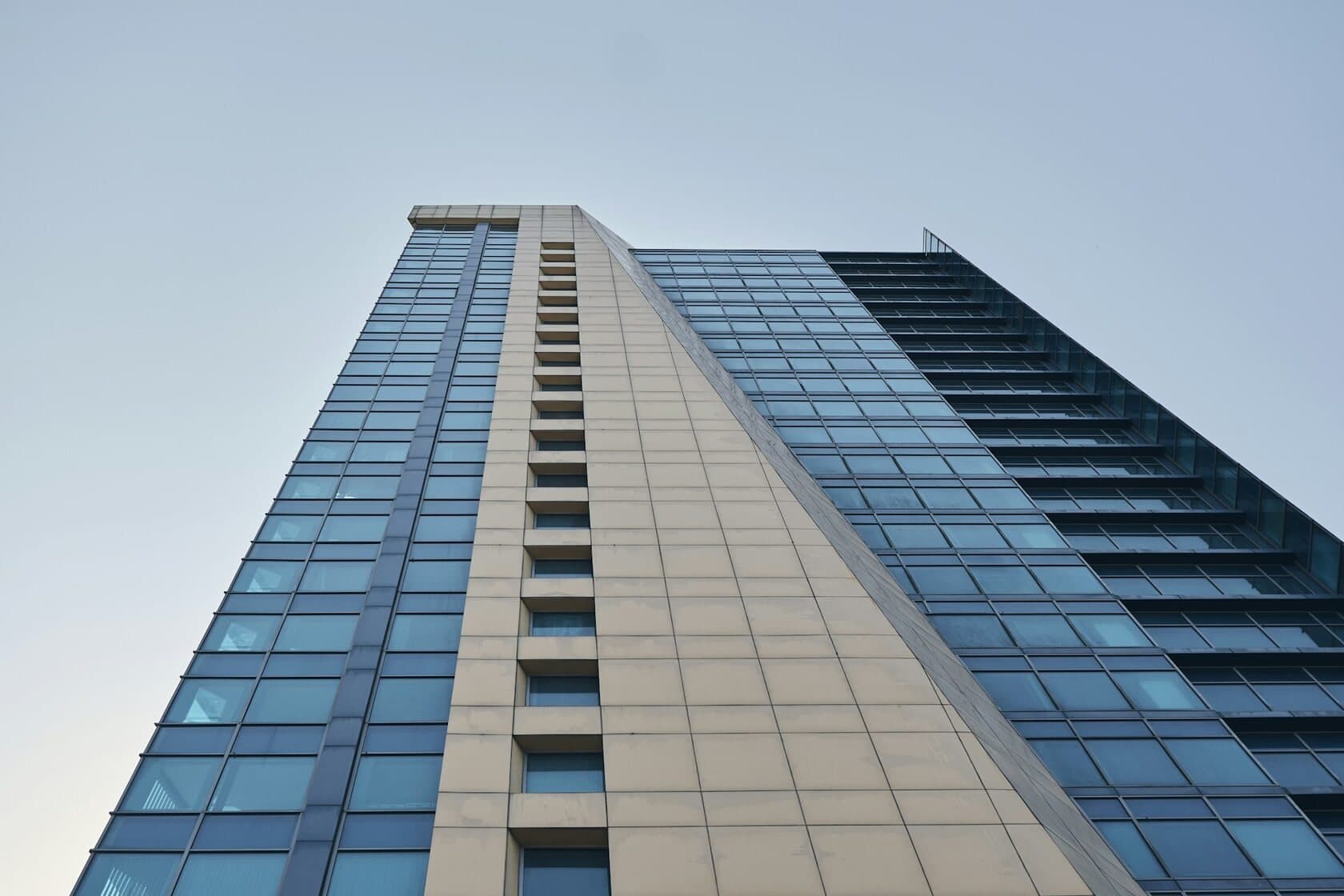 Glass office tower seen from street level