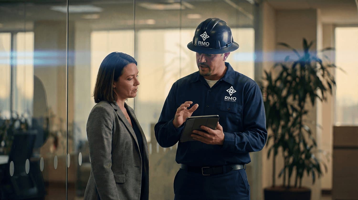 RMO technician walking a property manager through a damage assessment on a tablet