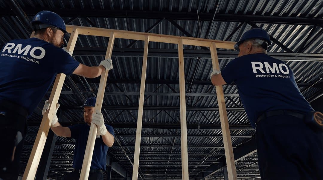 RMO crew raising new wall framing in a commercial space